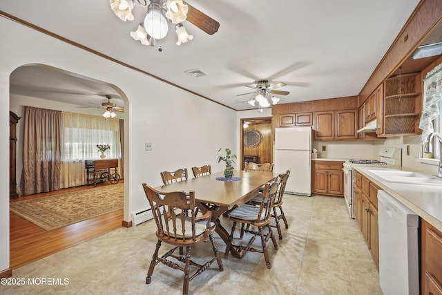 624 Lloyd Rd, Aberdeen, NJ 07747 - dining room featuring a ceiling fan, arched walkways, healthy amount of natural light, and crown molding