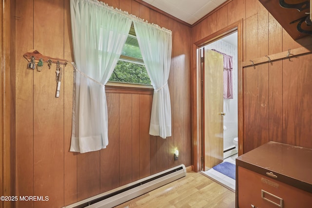 624 Lloyd Rd, Aberdeen, NJ 07747 - bathroom with baseboard heating, toilet, wood finished floors, wooden walls, and a baseboard radiator