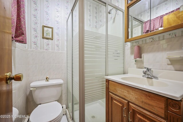 624 Lloyd Rd, Aberdeen, NJ 07747 - full bathroom with tile walls, toilet, vanity, and a shower stall