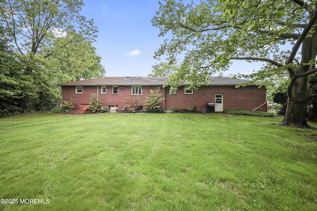 624 Lloyd Rd, Aberdeen, NJ 07747 - back of property featuring a yard and brick siding