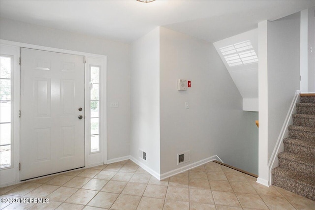 24 Hanna Ln Unit 304, Laurence Harbor, NJ 08879 - entryway featuring stairs, light tile patterned floors, and baseboards