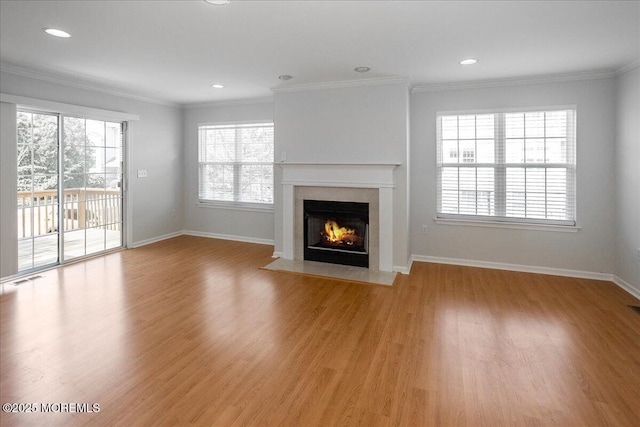 24 Hanna Ln Unit 304, Laurence Harbor, NJ 08879 - unfurnished living room featuring a high end fireplace, light wood finished floors, baseboards, ornamental molding, and recessed lighting