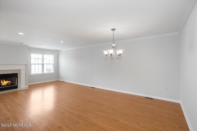24 Hanna Ln Unit 304, Laurence Harbor, NJ 08879 - unfurnished living room with a chandelier, a premium fireplace, light wood finished floors, ornamental molding, and baseboards