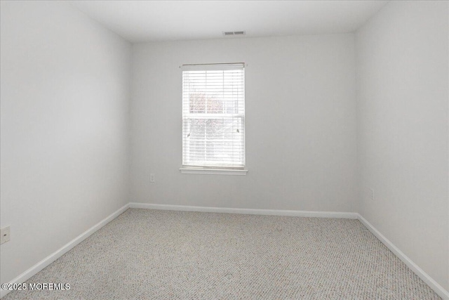 24 Hanna Ln Unit 304, Laurence Harbor, NJ 08879 - carpeted spare room with plenty of natural light and baseboards