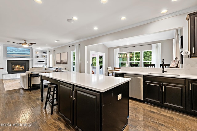 22 Imlay Ln, Farmingdale, NJ 07727 - kitchen featuring a sink, dishwasher, crown molding, a breakfast bar area, and dark cabinetry