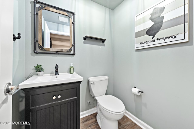22 Imlay Ln, Farmingdale, NJ 07727 - bathroom with toilet, wood finished floors, vanity, and baseboards