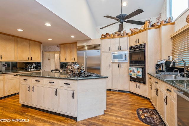 5 Stone Ln, Marlboro, NJ 07746 - kitchen featuring a sink, built in appliances, light brown cabinetry, a kitchen island, and ceiling fan