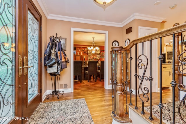 5 Stone Ln, Marlboro, NJ 07746 - foyer with a chandelier, light wood-style floors, ornamental molding, and baseboards