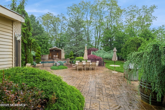 5 Stone Ln, Marlboro, NJ 07746 - view of patio featuring outdoor dining space, fence, and an outbuilding