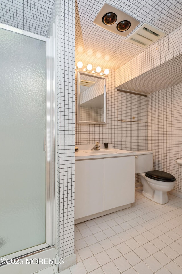 5 Stone Ln, Marlboro, NJ 07746 - full bathroom featuring a shower stall, tile patterned flooring, toilet, vanity, and tile walls