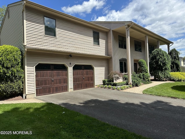 5 Stone Ln, Marlboro, NJ 07746 - view of front of house featuring a garage and driveway