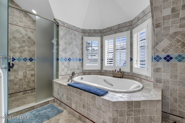 full bath with vaulted ceiling, a shower stall, a bath, and tile patterned floors