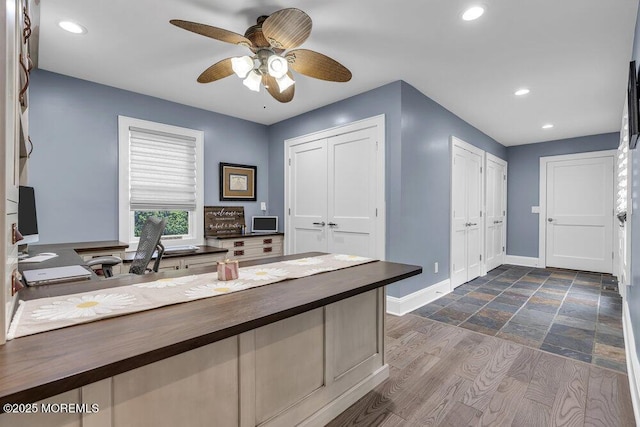bathroom featuring ceiling fan, recessed lighting, and baseboards