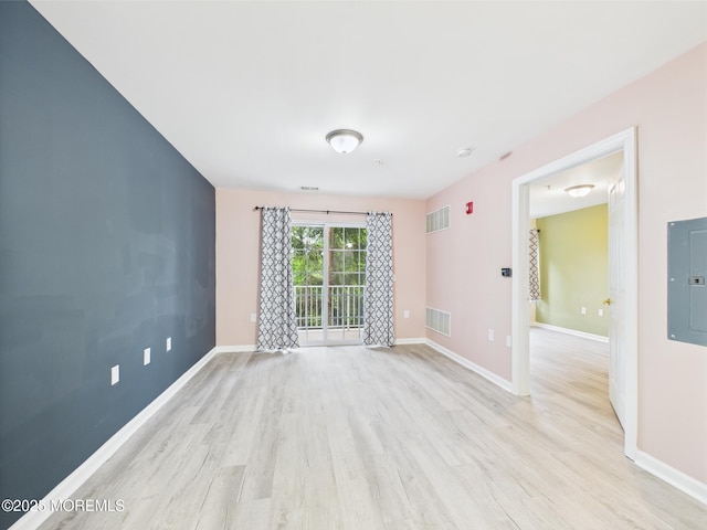 183 Liddle Ave, Edison, NJ 08837 - empty room featuring electric panel, light wood-type flooring, and baseboards