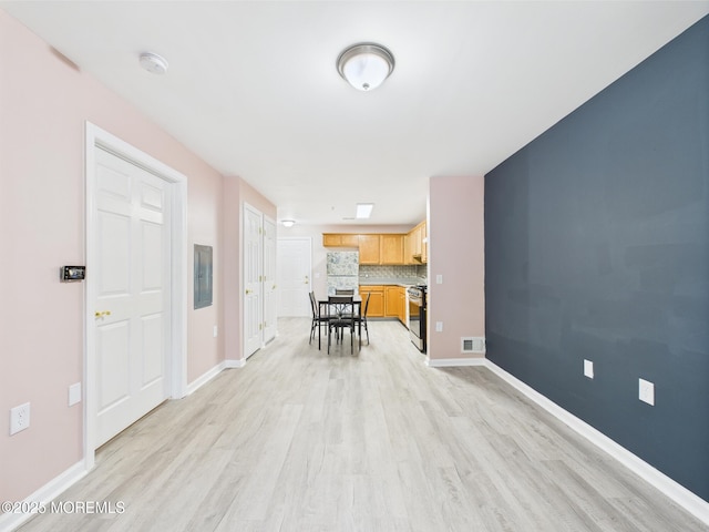 183 Liddle Ave, Edison, NJ 08837 - living room featuring light wood-style flooring, electric panel, and baseboards