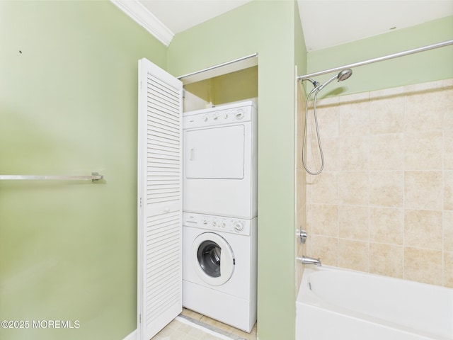 183 Liddle Ave, Edison, NJ 08837 - laundry area featuring stacked washer and clothes dryer, ornamental molding, and tile patterned flooring