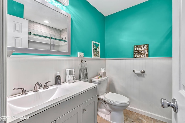 14 Santiago Dr W, Toms River, NJ 08757 - full bathroom featuring toilet, a wainscoted wall, vanity, and a shower