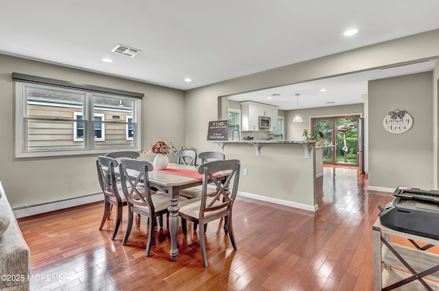 14 Santiago Dr W, Toms River, NJ 08757 - dining space with baseboard heating, wood-type flooring, recessed lighting, and baseboards