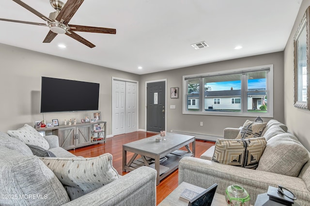 14 Santiago Dr W, Toms River, NJ 08757 - living room featuring baseboard heating, ceiling fan, recessed lighting, wood finished floors, and baseboards