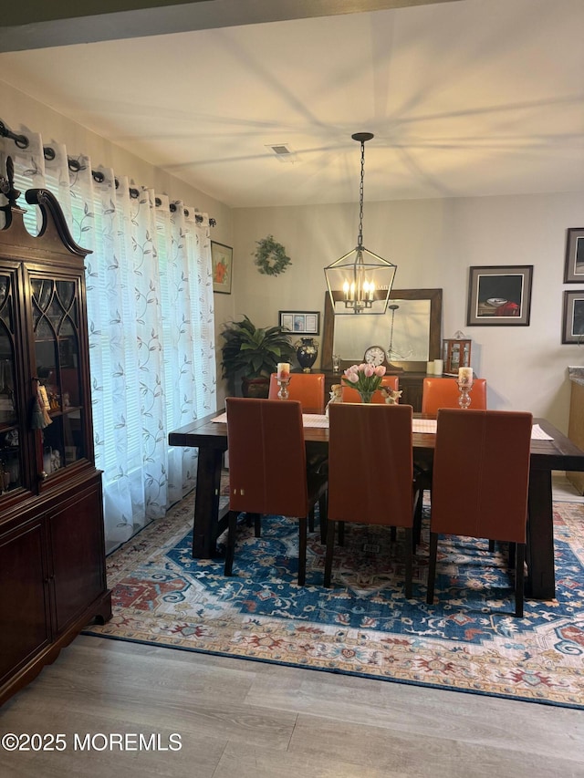 4 Capewoods Rd, North Cape May, NJ 08204 - dining room with a chandelier and wood finished floors