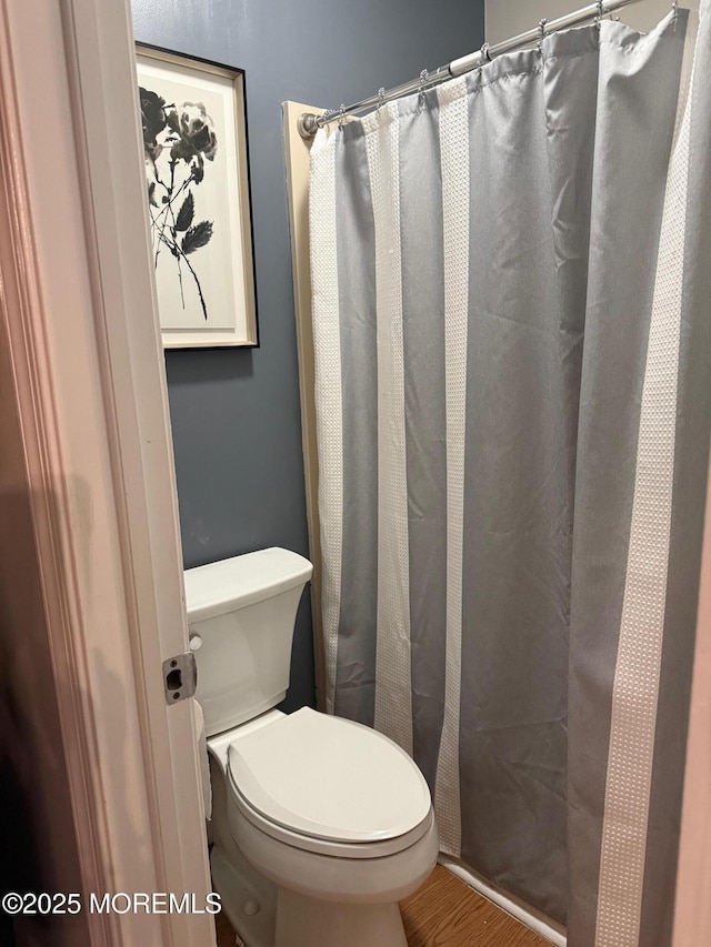 4 Capewoods Rd, North Cape May, NJ 08204 - bathroom featuring toilet, wood finished floors, and a shower with shower curtain