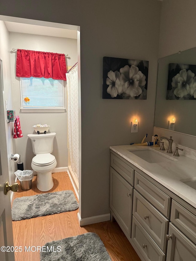 4 Capewoods Rd, North Cape May, NJ 08204 - bathroom with toilet, wood finished floors, vanity, and a shower with shower curtain