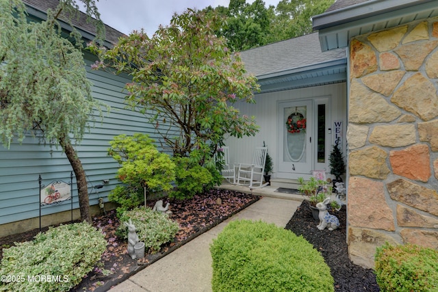 4 Capewoods Rd, North Cape May, NJ 08204 - doorway to property with a shingled roof and a porch