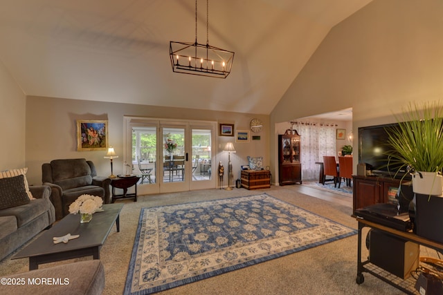 4 Capewoods Rd, North Cape May, NJ 08204 - carpeted living room with high vaulted ceiling and a chandelier