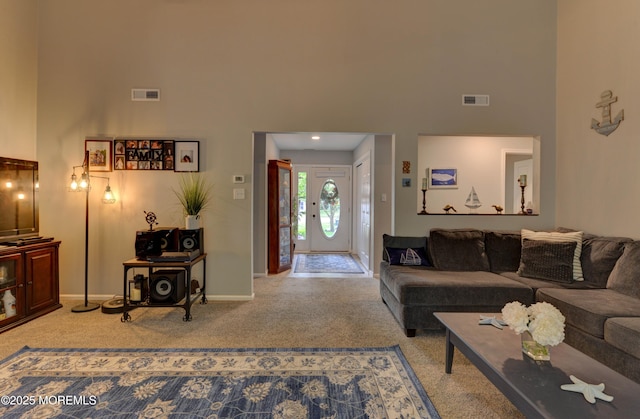 4 Capewoods Rd, North Cape May, NJ 08204 - carpeted living room with a high ceiling and baseboards