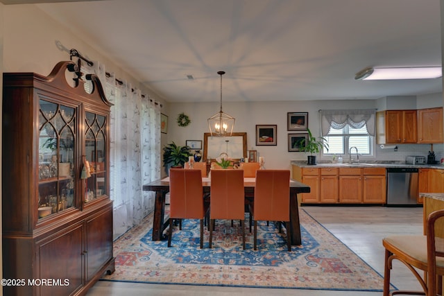 4 Capewoods Rd, North Cape May, NJ 08204 - dining area with light wood finished floors and a chandelier