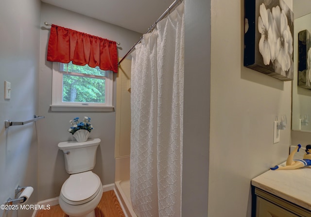 4 Capewoods Rd, North Cape May, NJ 08204 - bathroom with toilet, vanity, wood finished floors, baseboards, and shower / bathtub combination with curtain