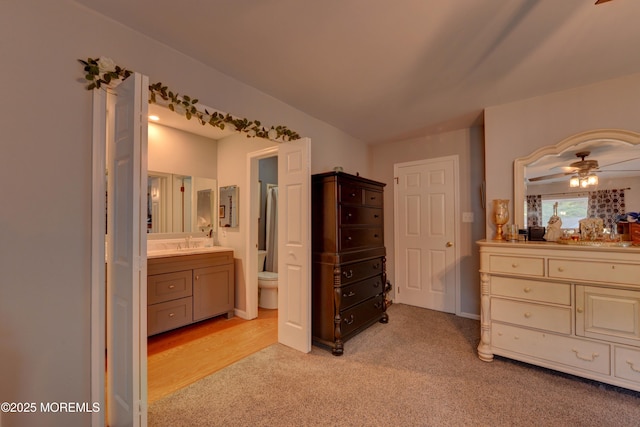 4 Capewoods Rd, North Cape May, NJ 08204 - bedroom with light colored carpet, a sink, and connected bathroom