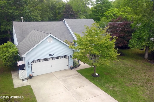 4 Capewoods Rd, North Cape May, NJ 08204 - view of front facade with an attached garage, driveway, a front yard, and roof with shingles