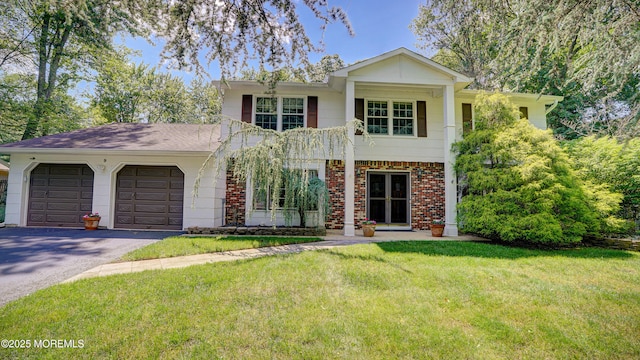 9 Toby Ter, Monroe, NJ 08831 - neoclassical home featuring driveway, a garage, a front lawn, and brick siding