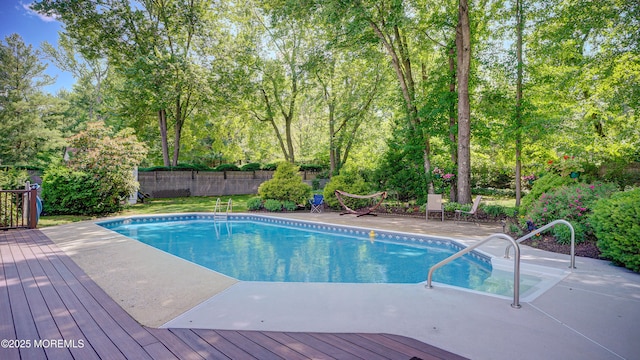 9 Toby Ter, Monroe, NJ 08831 - view of swimming pool featuring a deck and view of wooded area