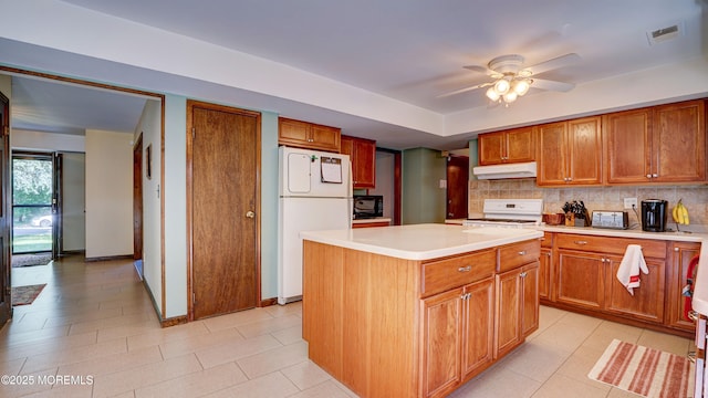 9 Toby Ter, Monroe, NJ 08831 - kitchen featuring white appliances, under cabinet range hood, light countertops, ceiling fan, and a kitchen island