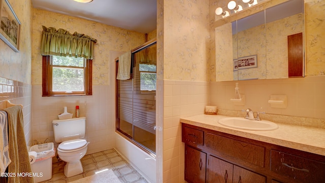 9 Toby Ter, Monroe, NJ 08831 - full bathroom with tile walls, wallpapered walls, toilet, vanity, and a wainscoted wall