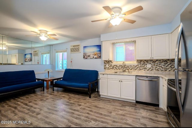 140 Hancock Ave Unit 1, Seaside Heights, NJ 08751 - kitchen featuring appliances with stainless steel finishes, ceiling fan, a sink, and tasteful backsplash