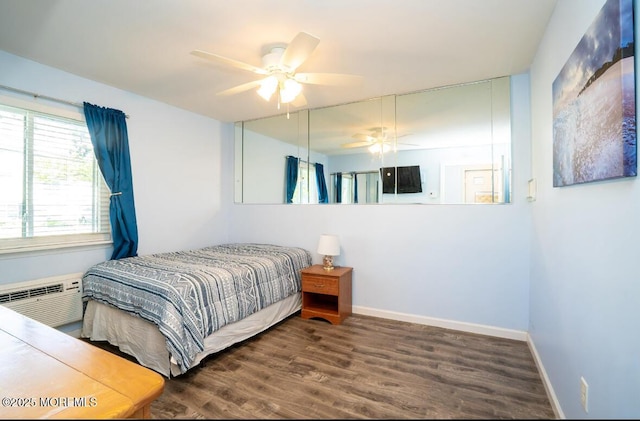 140 Hancock Ave Unit 1, Seaside Heights, NJ 08751 - bedroom featuring a wall mounted air conditioner, wood finished floors, baseboards, and a ceiling fan