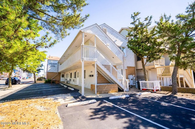 140 Hancock Ave Unit 1, Seaside Heights, NJ 08751 - view of property with stairway and uncovered parking