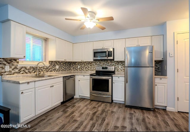 140 Hancock Ave Unit 1, Seaside Heights, NJ 08751 - kitchen with appliances with stainless steel finishes, a sink, decorative backsplash, and white cabinets