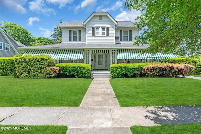 208 Ludlow Ave, Spring Lake, NJ 07762 - view of front of home with a front lawn and roof with shingles
