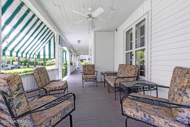 208 Ludlow Ave, Spring Lake, NJ 07762 - wooden porch with a ceiling fan