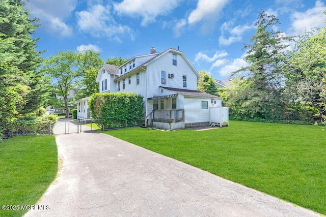 208 Ludlow Ave, Spring Lake, NJ 07762 - view of front of property featuring a gate, a chimney, and driveway