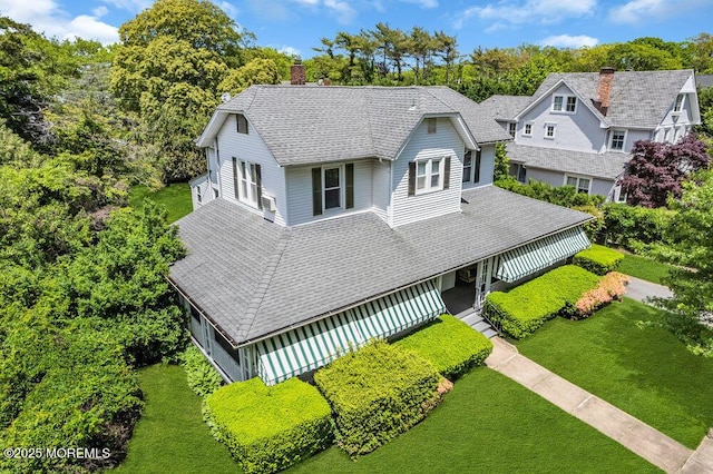208 Ludlow Ave, Spring Lake, NJ 07762 - view of front of house with a front lawn, a chimney, and a shingled roof