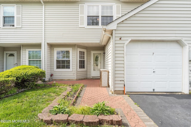 7 Sloop Sq, Freehold, NJ 07728 - property entrance featuring a garage and driveway
