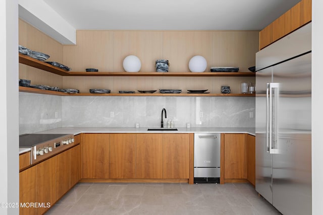 27 N Ward Ave, Rumson, NJ 07760 - kitchen featuring stainless steel appliances, a sink, open shelves, light countertops, and backsplash