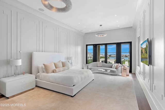 27 N Ward Ave, Rumson, NJ 07760 - bedroom with a decorative wall, light wood finished floors, recessed lighting, and a towering ceiling