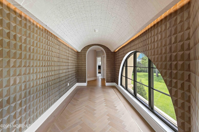 27 N Ward Ave, Rumson, NJ 07760 - corridor with lofted ceiling, arched walkways, and baseboards