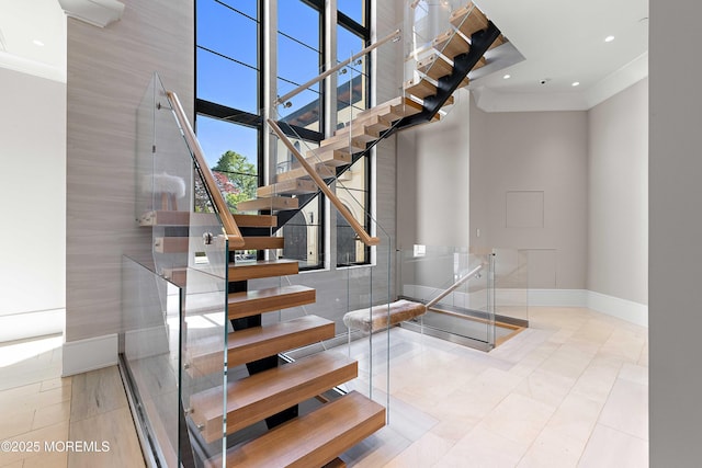 27 N Ward Ave, Rumson, NJ 07760 - staircase with ornamental molding, baseboards, a high ceiling, tile patterned flooring, and recessed lighting